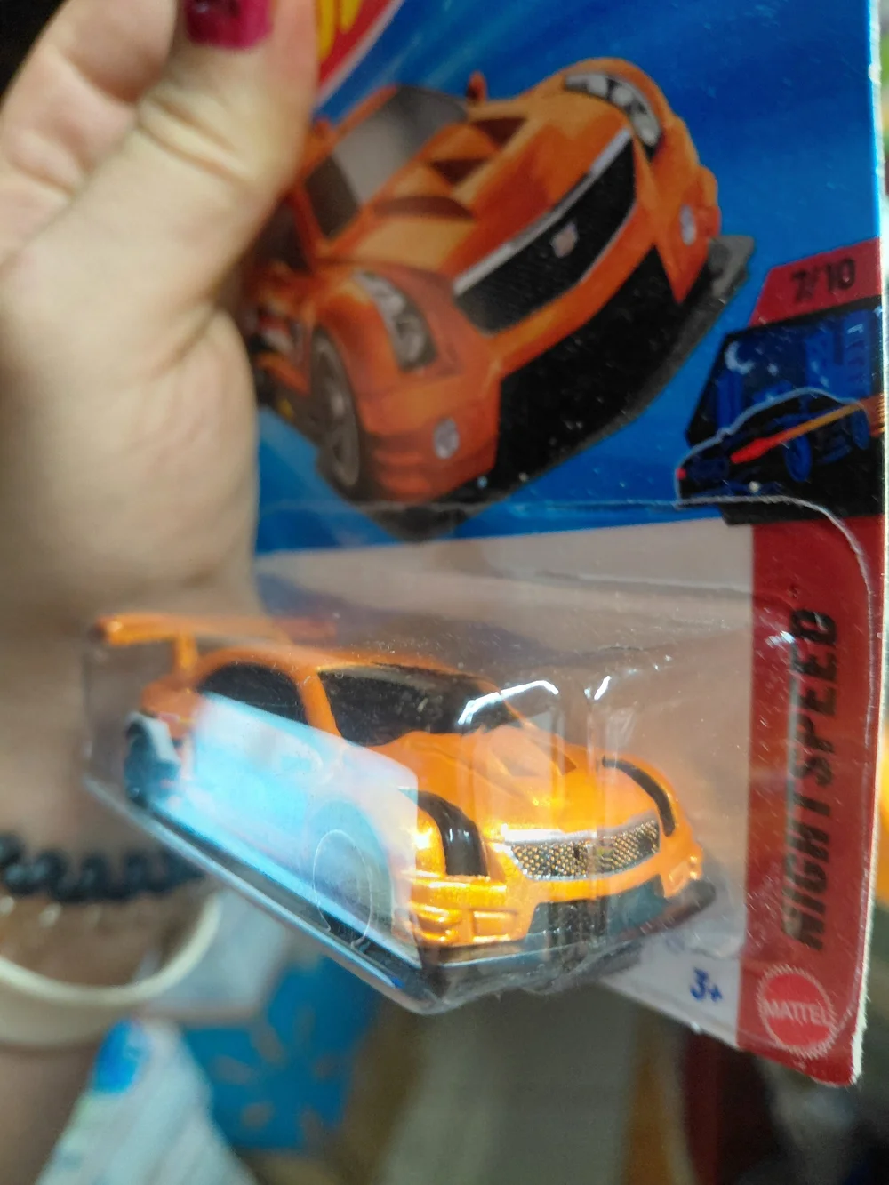 The Hot Wheels '16 Cadillac ATS-V R (orange, 90/250) is a 1:64 scale diecast car